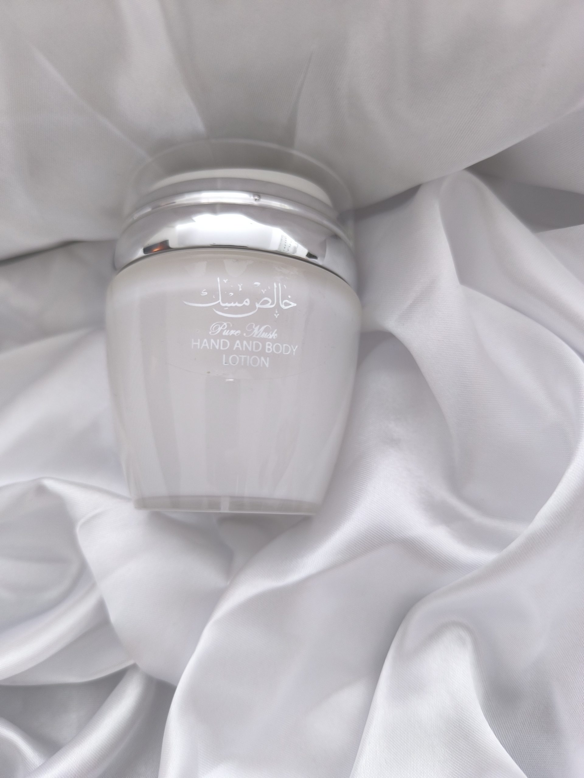 Image d'une bouteille blanche de la lotion pure musk